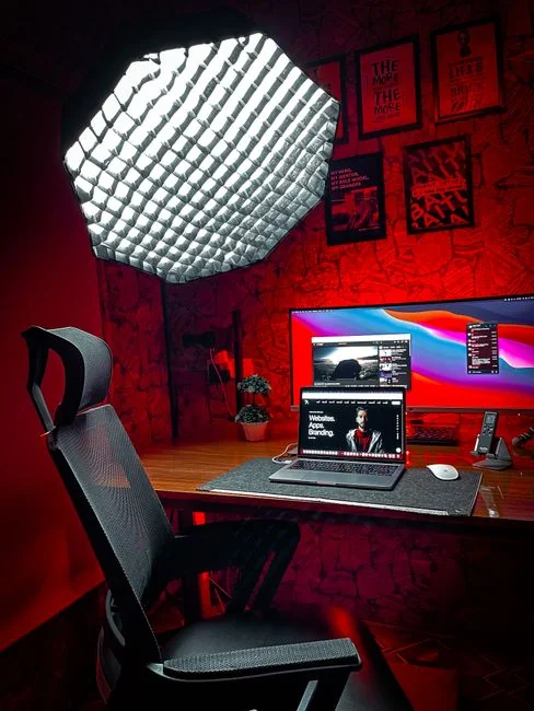 A modern computer screen displaying web design work, showcasing creative visuals in a workspace.